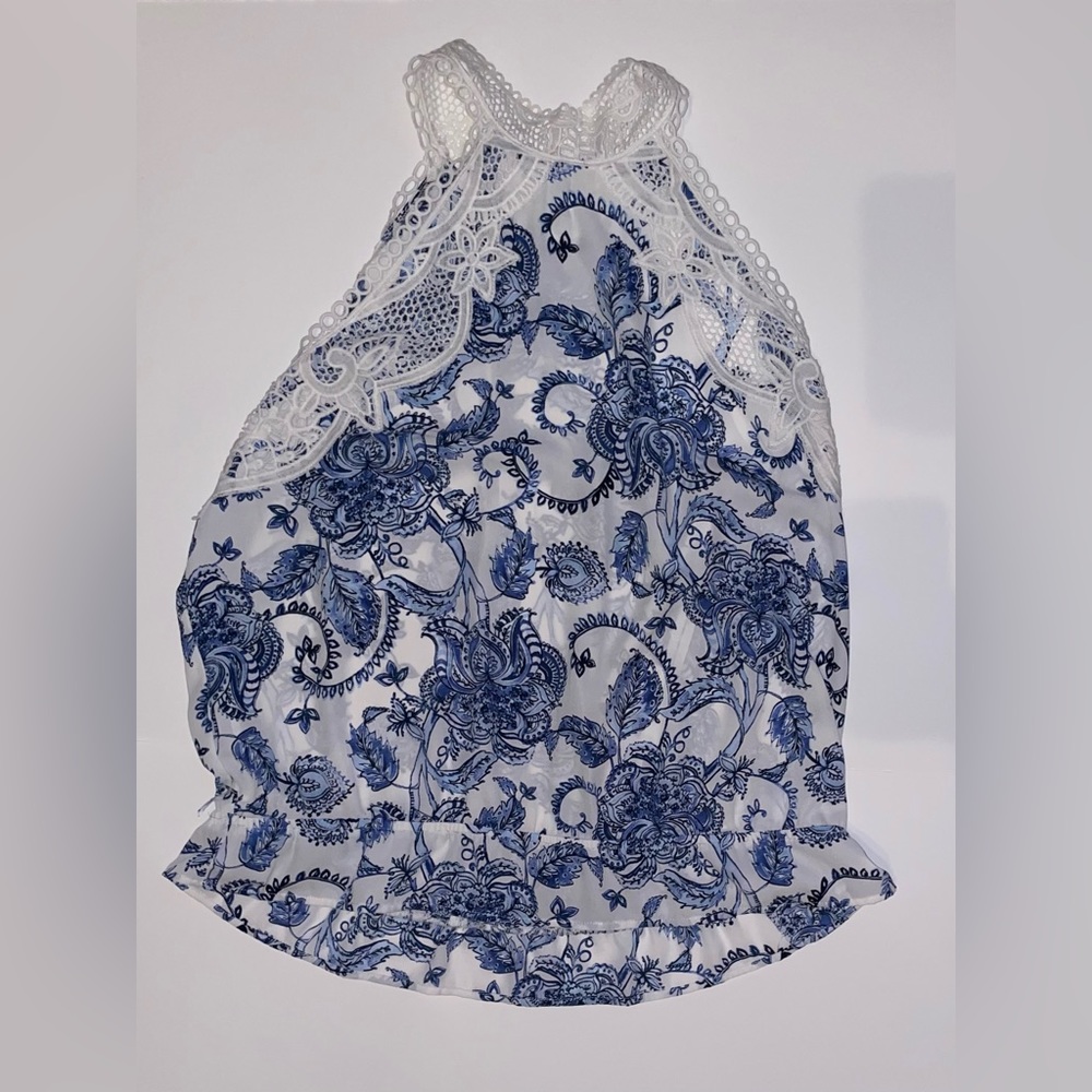 Sleeveless blue and white shirt